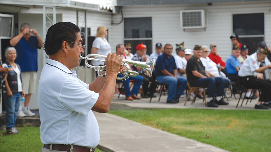 Bugler Ignacio Garcia plays taps. Photo: Mary Beth Wright/LFN.
