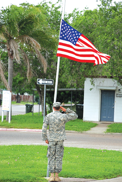 Army Infantryman of Ft. Hood James Counelis salutes to the flag during the ceremony. Photo: Mary Beth Wright/LFN