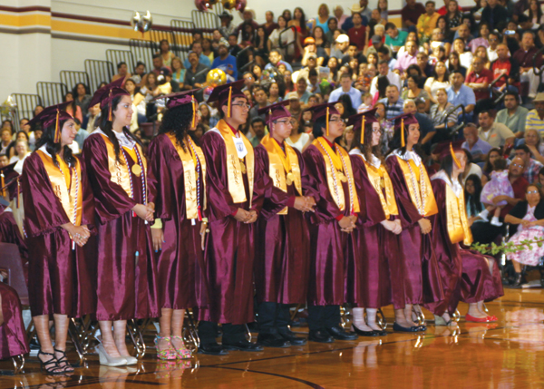 Students stand up to recieve their diplomas at the 2013 Graduation Commencement Ceremonies on Friday, June 7th. Photo: David Briones/LFISD