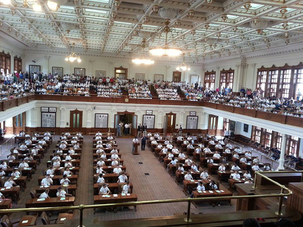 Boys and parents on the House Floor at The Texas State Capitol. Photo: Cindy Hinojosa