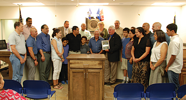 City of La Feria Mayor Steve Brewer (holding plaque) presents the Keys to the City to the Dominguez Family for their many years of community service. Members of the city council are standing behind the family. Photos: MBWright/LFN.
