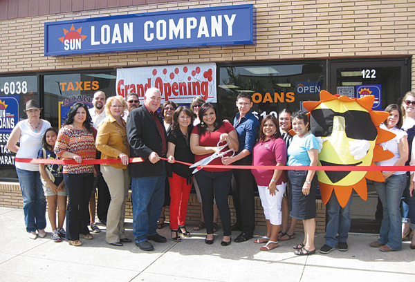 Sun Loan Company Area Supervisor Brenda Blanco (center) cuts the ribbon to officially open the new La Feria location on Commercial Avenue across the street from city hall. Also holding the ribbon for the event is (l-r) Maria Chavero, Mayor Pro-Tem Lori Weaver, Mayor Steve Brewer, La Feria Office Manager Lidia Hernandez, Brenda Blanco, La Feria Assistant Manager Jose Sanchez and Floating Manager Adriana Vega. Photo: Bill Keltner/LFN 