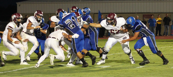 The Lion defense swarms in on the Gator.