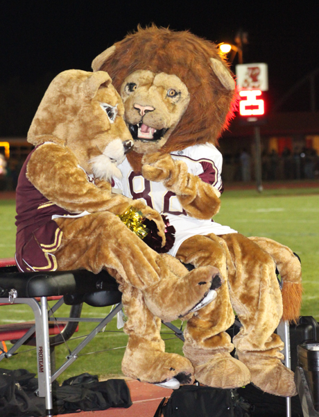 The Lion mascots taking a break from cheering for the Lions.