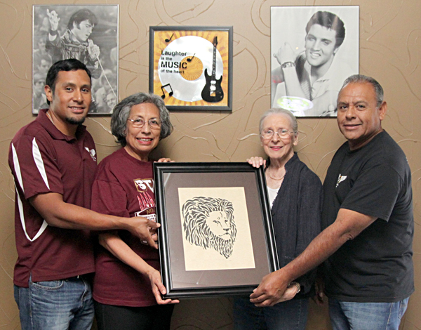  Eddie Casas, Gloria Casas, Bernice Coleman, artist; and Jaime Casas proudly display the Lion drawing done by Bernice several years ago.