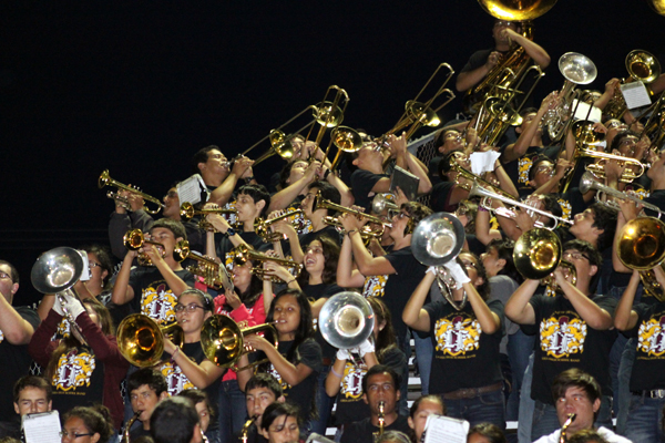 Above, The Lion band performs during a shortened game.