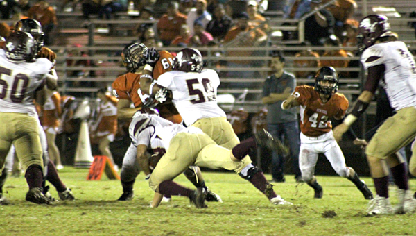 Andres Rosales blocks for the running back.