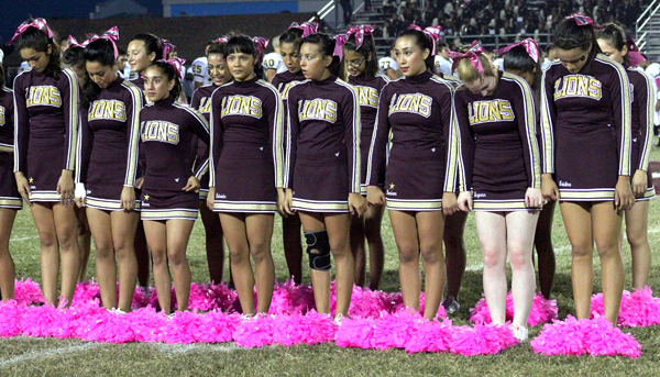 The Lion Cheerleaders prepare for the school song.