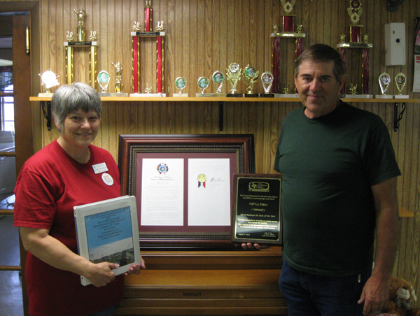 John and Ruth Dearinger showing recent awards and plaques. Photo: Bill Keltner/LFN