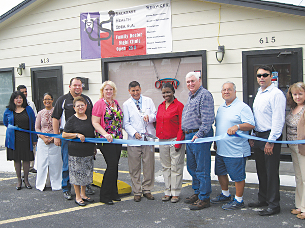 Dr. Ubaldo J. Salazar (cutting the ribbon) and  Registered Dietitian Michele Salazar (to his right) celebrate the opeing of Salazar’s Health Ideas surrounded by members of the La Feria City Commission and city staff.