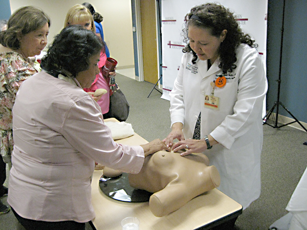 Doctor Munoz demonstrates proper way to perform a breast self-examination.