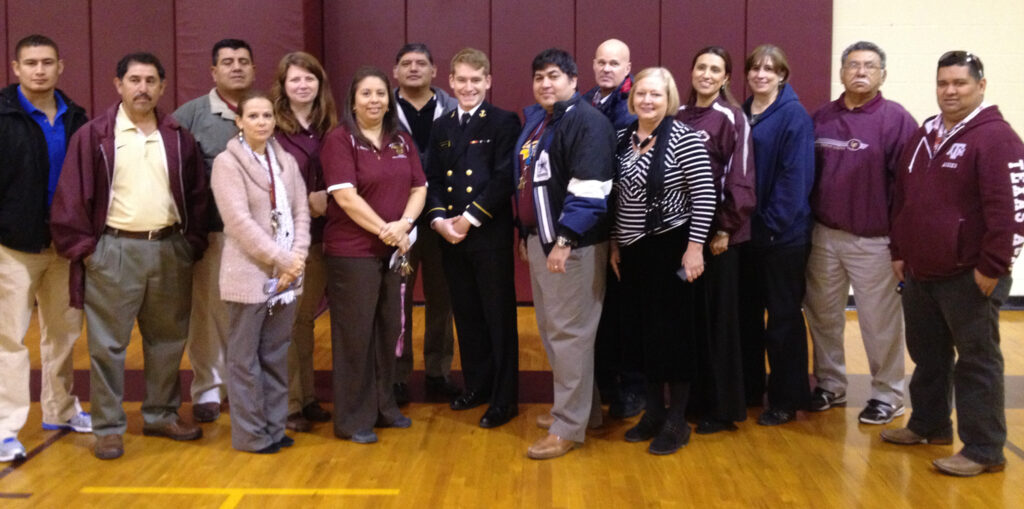 Midshipman First Class Thomas Kraft of Harlingen with eighth grade teachers at Green Junior High. Photo: special to LFN