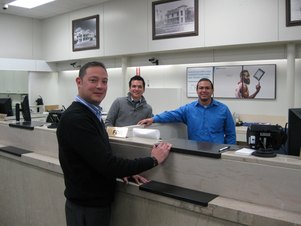 Officers ready to serve you: (l-r) J.G. Disiga, Manager of Tellers; Rene Romero, Bank President; Adrian Bernal, Personal Banker.