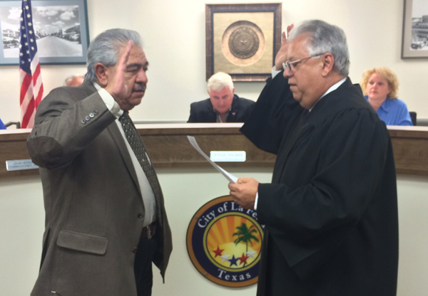 Newly-elected Mayor of La Feria Victor Gonzalez, Jr. is sworn-in to office by Judge Roy Valdez , Chief Justice of the 13th Court of Appeals. Photo: Cayetano Garza Jr.