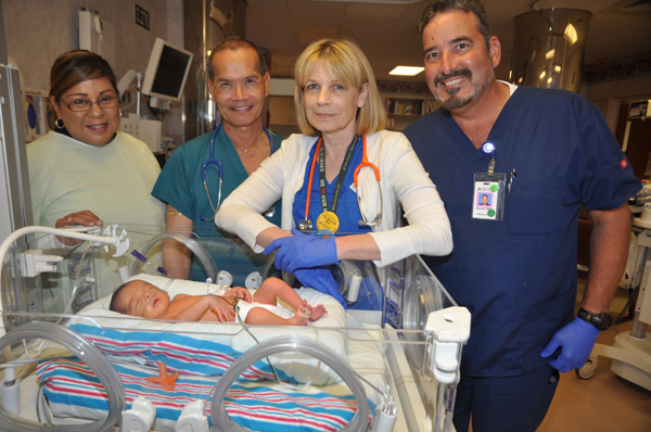A Newborn Intensive Care Unit at Valley Baptist Medical Center in Harlingen is helping to care for the Valley’s youngest patients, such as baby Melynda Reyes of Lyford, who was born Sept. 11.  Checking on the baby in the neonatal care unit are, from the left, the baby’s mother Imelda Reyes (of Lyford); Dr. Cheng-hurd Liu, Neonatologist; Rita Goodarzi, RN, Nurse Manager for the Newborn ICU; and David Leal, RRT, Respiratory Therapist.