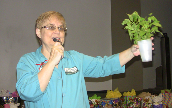 Debbie Diehl, founder of a H.O.P.E. Stroke Support Group which meets in Harlingen monthly, hands out a “hope plant” (Esperanza plant) as a prize during a meeting for stroke survivors and family members at Valley Baptist Medical Center. 