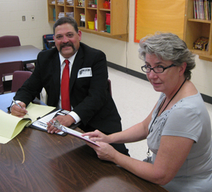 Judge Mike Trejo and Assistant Principal Mary Sanchez discuss the presentation.