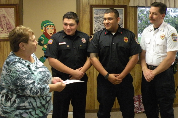 Representatives from the La Feria Volunteer Fire Dept. accepting funds from the charity auction. 