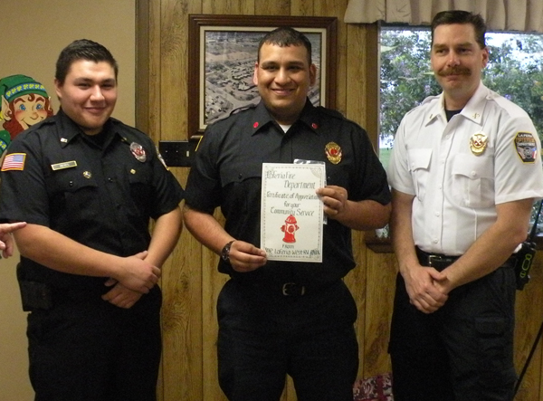Representatives from the La Feria Volunteer Fire Dept. accept funds from the charity auction. 