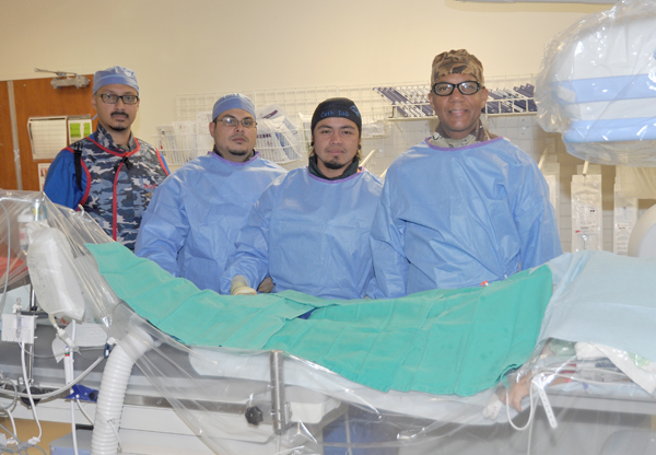 Dr. Farley Neasman, right, Interventional Cardiologist, treated the first patient in Texas with a new type of “medication-coated balloon” to open blocked arteries in her legs Feb. 4 at Valley Baptist Medical Center in Harlingen. 