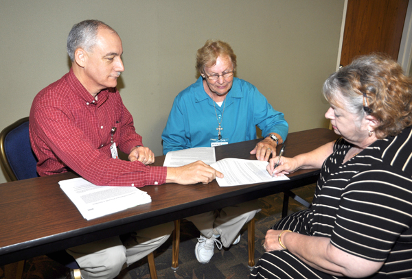 Chaplains and Pastoral Services Volunteers at Valley Baptist Medical Center, including Chaplain Christian Hall, left, are available to help patients and family members with healthcare decisions documents such as advanced directives.