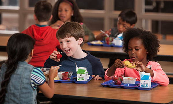 More children are getting their first meal of the day at school and benefiting from better nutrition standards, according to a new report from the Food Research and Action Center. Photo courtesy of U.S. Department of Agriculture.