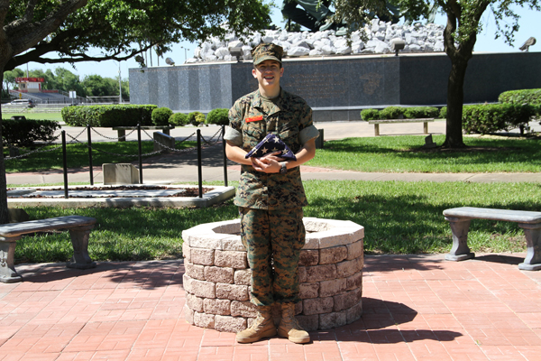 Marine Military Academy junior Robert Walter III of Fair Oaks Ranch, Texas, stands beside the new flag retirement facility located on the MMA campus. Photo: MMA