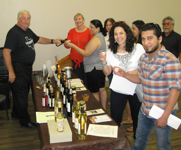 Guests sampling wines from La Vaca Bluffs Winery of Lolita,TX.