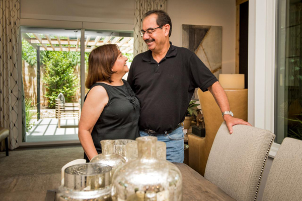 The Villarreals pose in the dining room of the high-tech Austin Home during a tour at the end of this month.