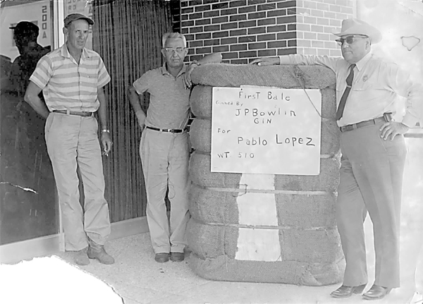 Undated (possibly 1950’s) photograph of JP Bowlin Gin’s first bale of cotton in La Feria for Pablo Lopez, grower and coincidentally town constable in the 50’s, seen here with Joe Peets and Nick Ruth, field man. Photo submitted by Alvino Villarreal.