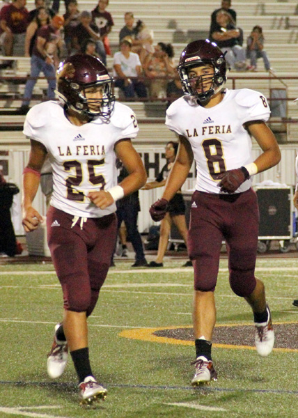 Omar Mughrabi and Isaiah Martinez heading off the field after an offensive series.