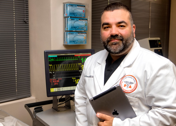 Elias Villarreal Jr., a clinical associate professor in the UTRGV Department of Physician Assistant, uses Apple iPads to deliver information and actively involve students. Photo: David Pike/UTRGV