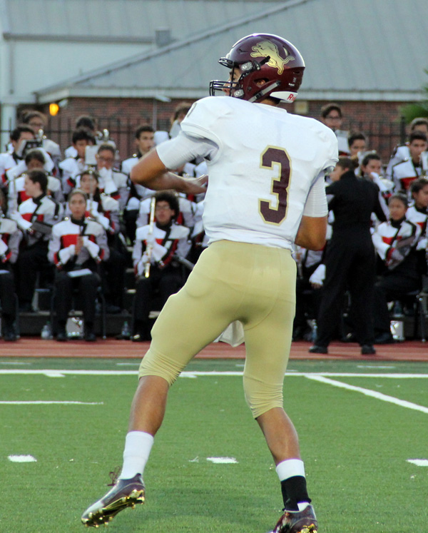 Isaac Galpin looks for an open receiver.