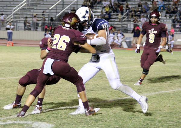 Mario Rodriguez brings down the ball carrier.