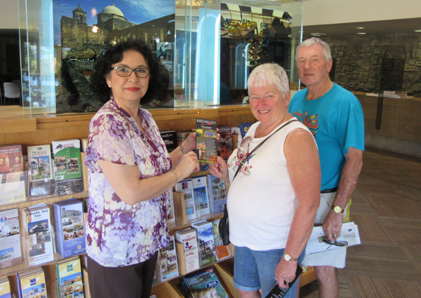 Counselor Rachel Garza points out interesting places to visit in the Valley to Carol and Bud Van Dyke from Pleasant Hill, Iowa. 