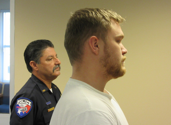 Jeremy Bridges is brought in for arraignment by Primera Police Chief Manuel Trevino. Photo: Bill Keltner/LFN.