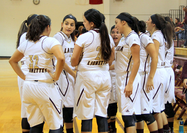 Lionettes discuss strategy during the timeout.