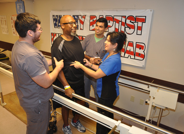 Charles Reginald Coats, a Navy veteran, receives intensive rehabilitation for an injury at the Inpatient Rehabilitation Unit at Valley Baptist Medical Center in Harlingen. Assisting Mr. Coats, from the left, are Elijah Gonzalez, physical therapy assistant; Marty Villarreal, DPT, Physical Therapist; and Dacia Veloz, RN, BSN, nurse with the Inpatient Rehab Unit. 