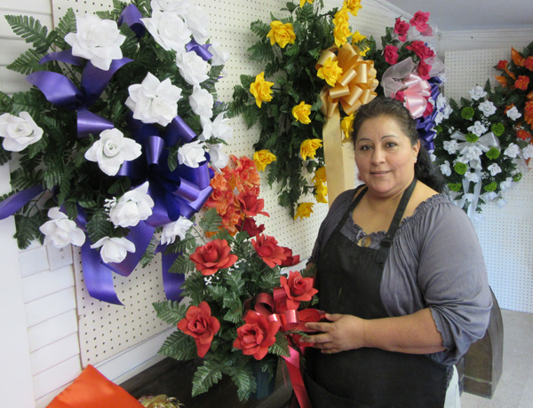 Tonie holds one of her flower creations.