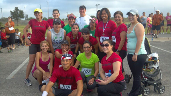 Participants take a quick picture during 2013’s Adrian Dominguez Benefit Race/Walk. Photo: Facebook/ Tom RuNsane Running