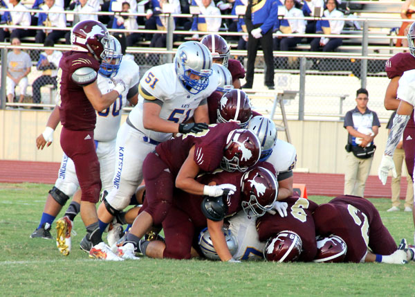 The Lion defense takes down the Bearkat runner.