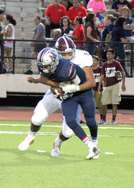 Marc Tamez brings down the Eagles quarterback.