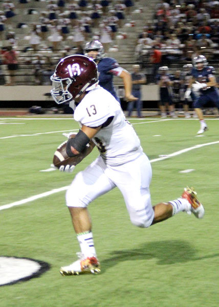 Jayden Juarez takes off down field after catching a pass.