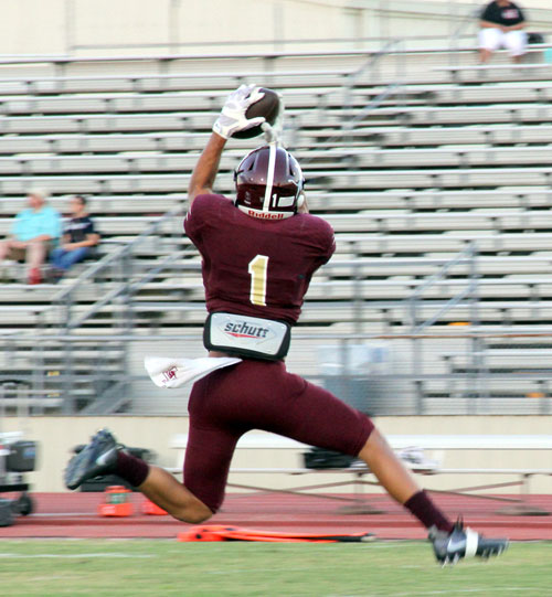 Brandon Perez going up for a pass during warm ups.
