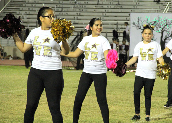 Junior Gold Stars perform during the half.