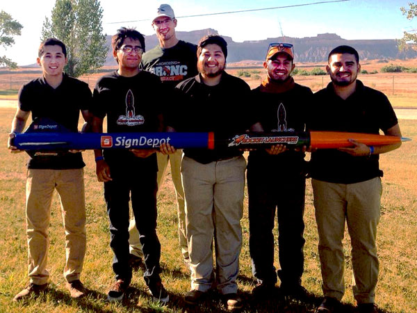 The Rocket Launchers at UTRGV team placed second among U.S. competitors and seventh among all 44 international competitors, in the Experimental Sounding Rocketry Association’s 2016 Intercollegiate Rocket Engineering Competition, held in Green River, Utah. Shown at the competition with their rocket are Rocket Launchers members Eliel Martinez, social media officer; Marco Pina, financial officer; Enrique Molina, propulsion lead; Felipe Gaitan, secretary officer; and Justin Osorio, team captain. At rear is Allen Owens, safety officer. Photo: Courtesy UTRGV