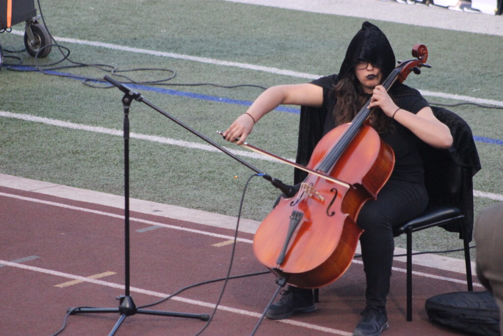 Cellist Erica Martinez braves the rain with elegance and style at this year’s Pigskin Jubilee. Photo: LFISD