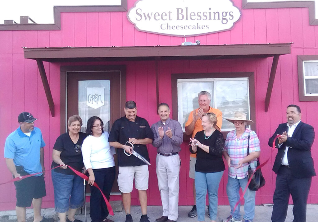 Jaime Martinez stands with La Feria Chamber members and community leaders at the ribbon cutting ceremony for his new cheesecake shop in La Feria last Tuesday, November 1st. Photo: La Feria Chamber of Commerce